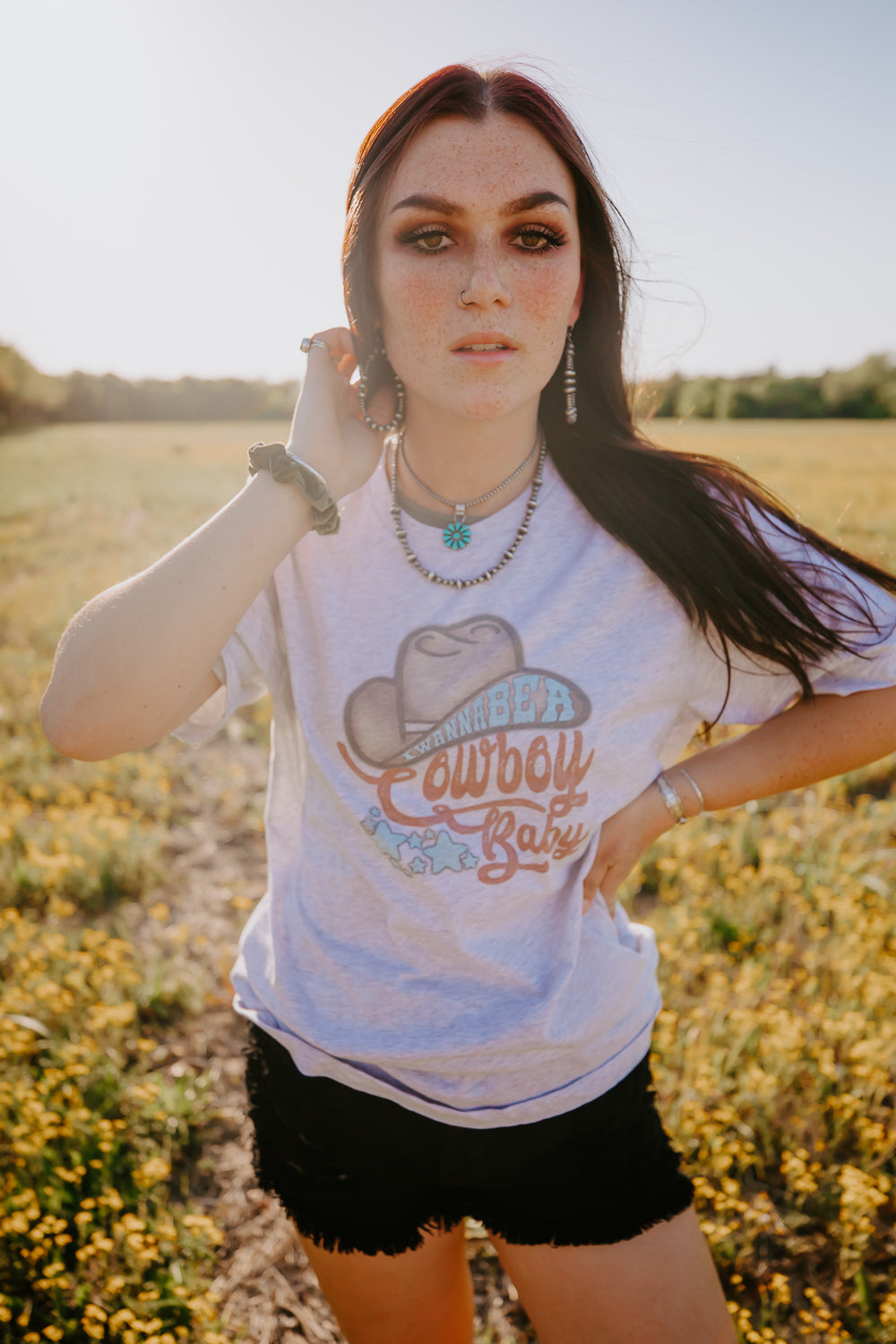 Graphic tee printed with I wanna be a cowboy baby