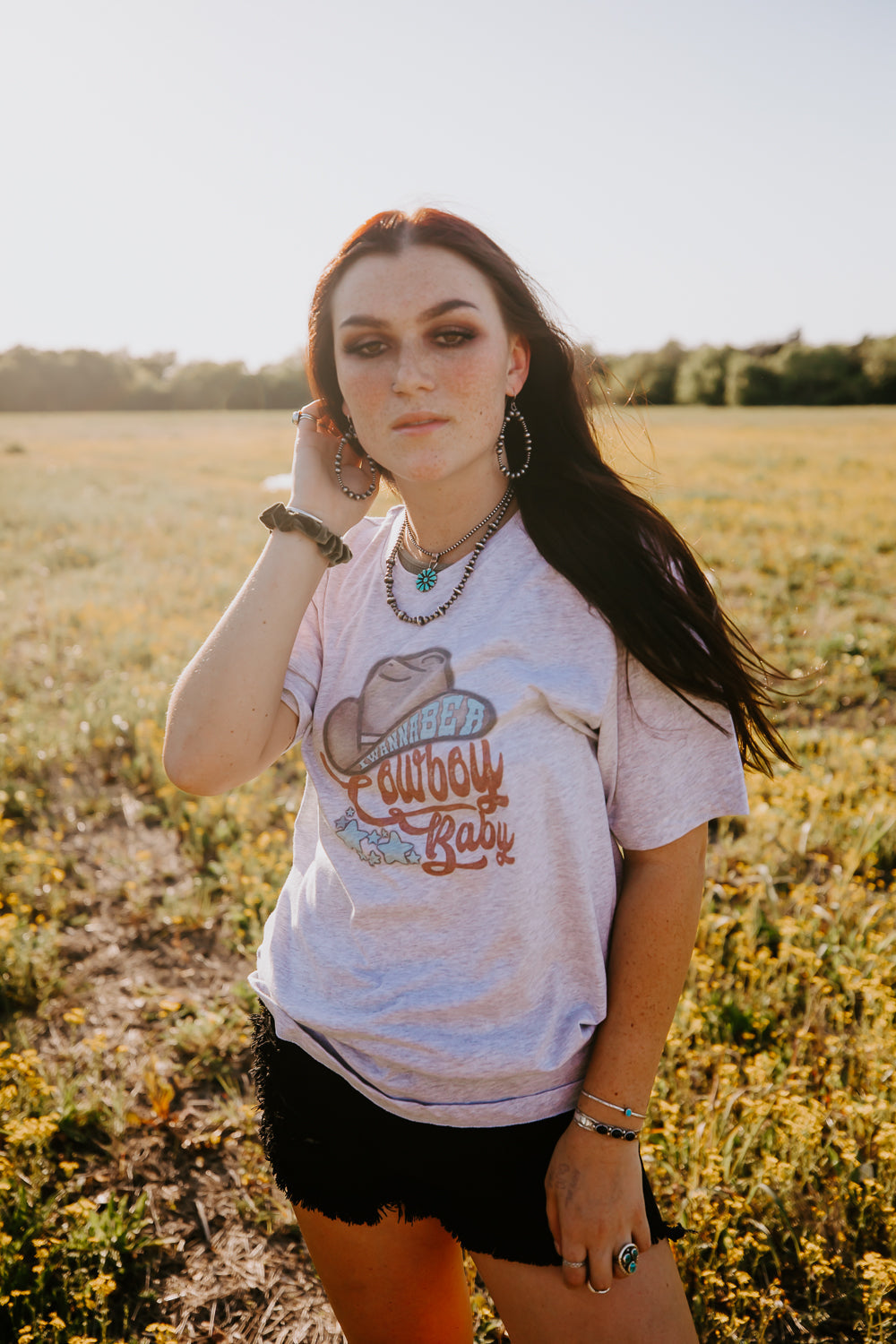 Western graphic tee with I wanna be a cowboy baby lyrics