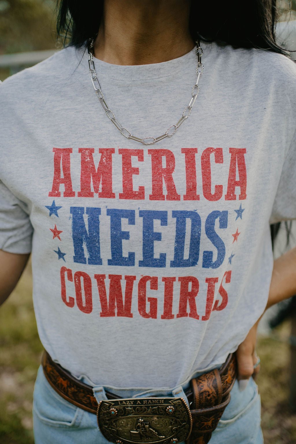 America Needs Cowgirls TeeWhiteS