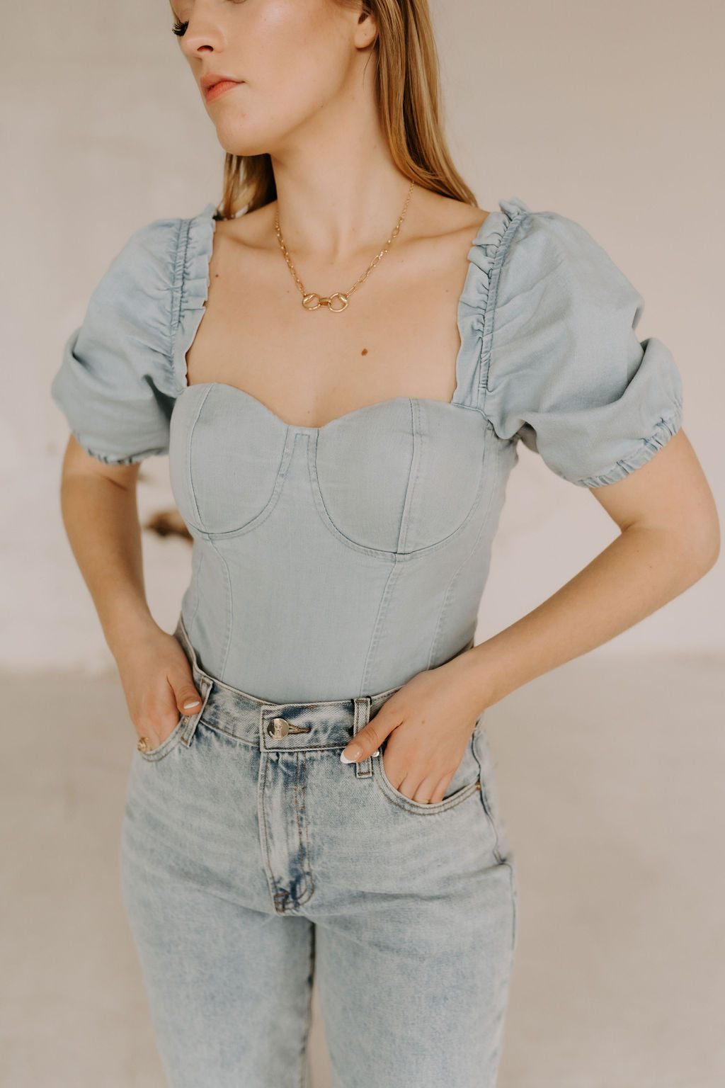 The Riley Denim Bodysuit in Light Wash